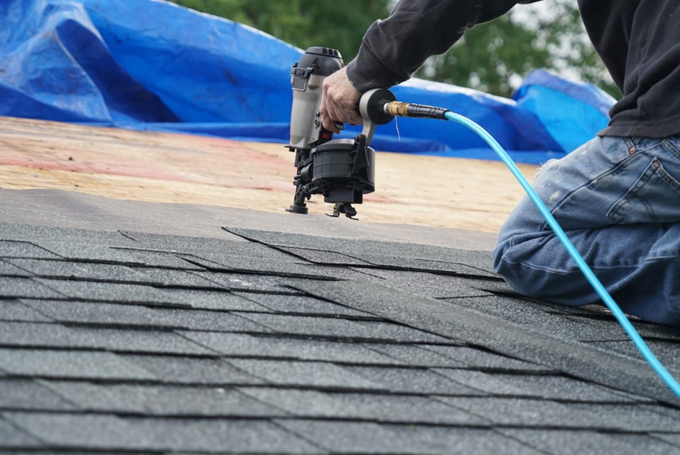 man working on roof