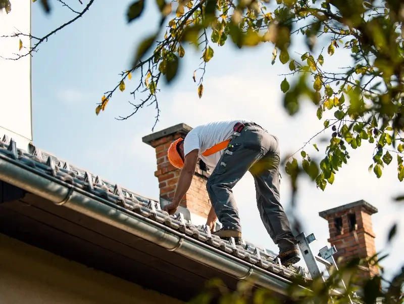 Man working on a roof in North Carolina