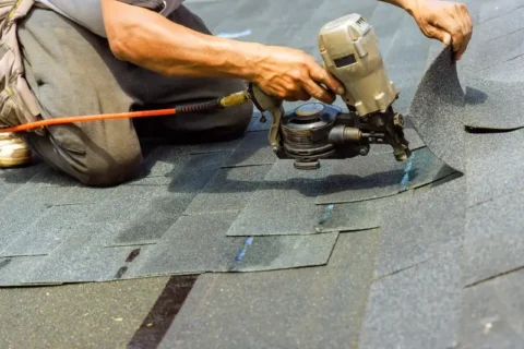 Contractor in North Carolina installing new shingles