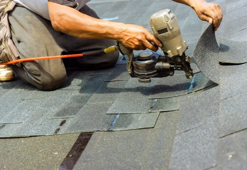 Contractor in North Carolina installing new shingles
