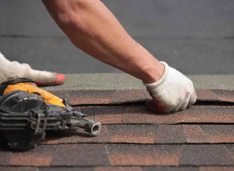 Man repairing a roof in North Carolina.